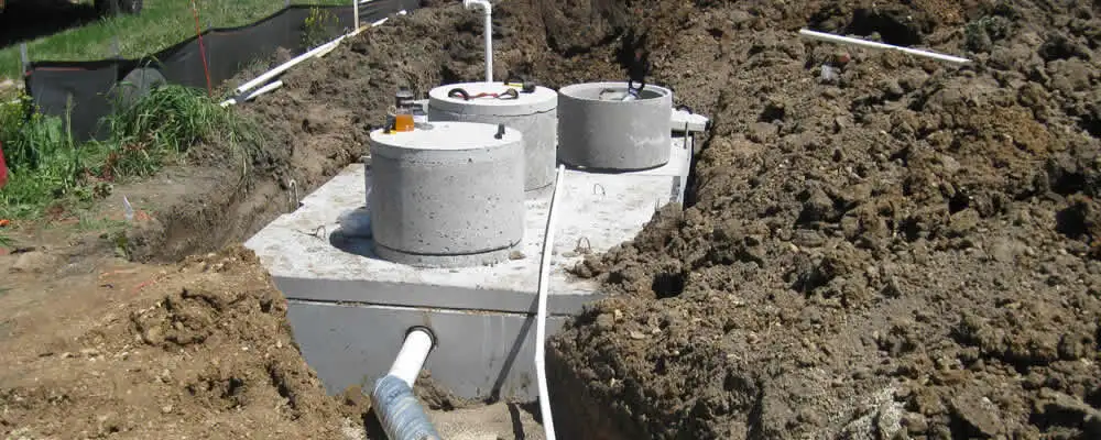 Septic system repair and installation site with tank access ports in Palm Springs, CA