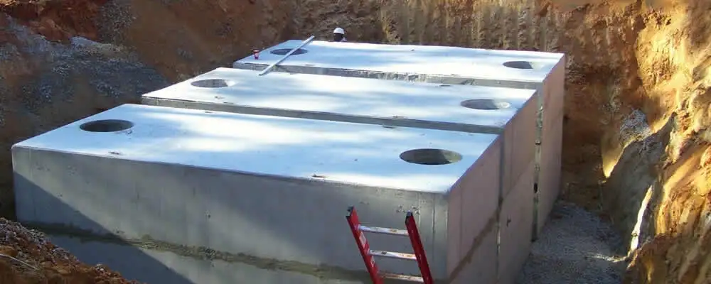 Septic tank installation site with a newly placed concrete tank in Palm Springs, CA